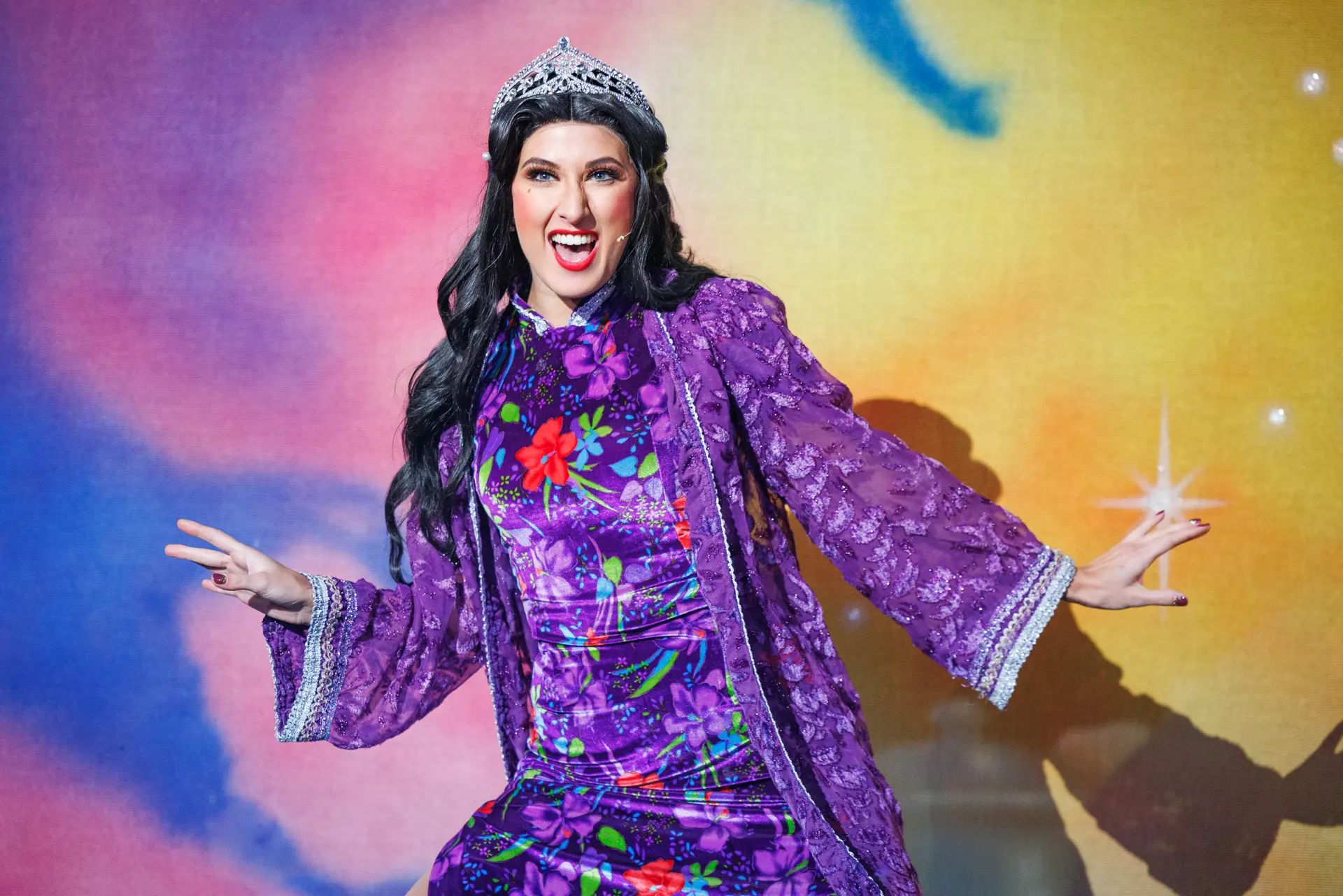 Princess Jasmine in costume performing in Aladdin at the Marina Theatre Lowestoft under colourful lighting, with dramatic set elements. Captured by Performing Arts Photography specialist, Fourth Wall Photography.