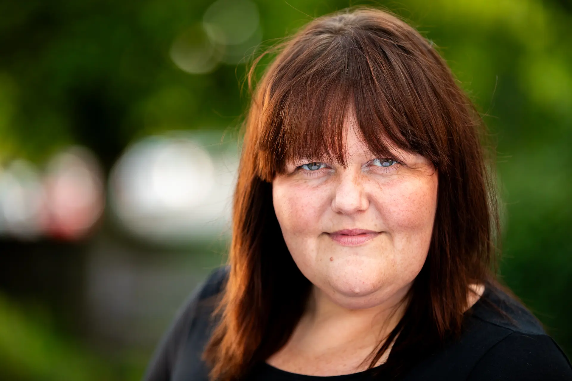 Professional headshot of Laura Guest, captured by Fourth Wall Photography in Norfolk, with soft lighting and a neutral background.