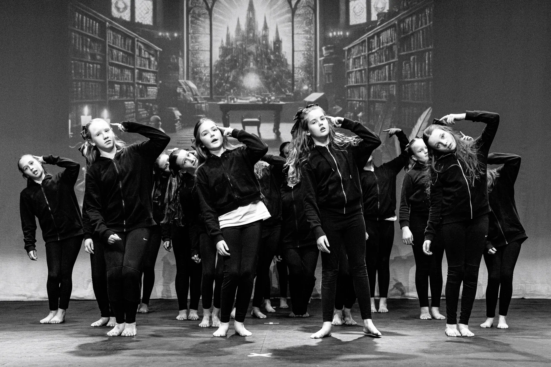 Young dancers performing a street dance routine at the Schools Dance Festival at the Marina Theatre Lowestoft. Captured mid‑movement on stage with vibrant lighting. Captured by Dance photography specialist, Fourth Wall Photography.