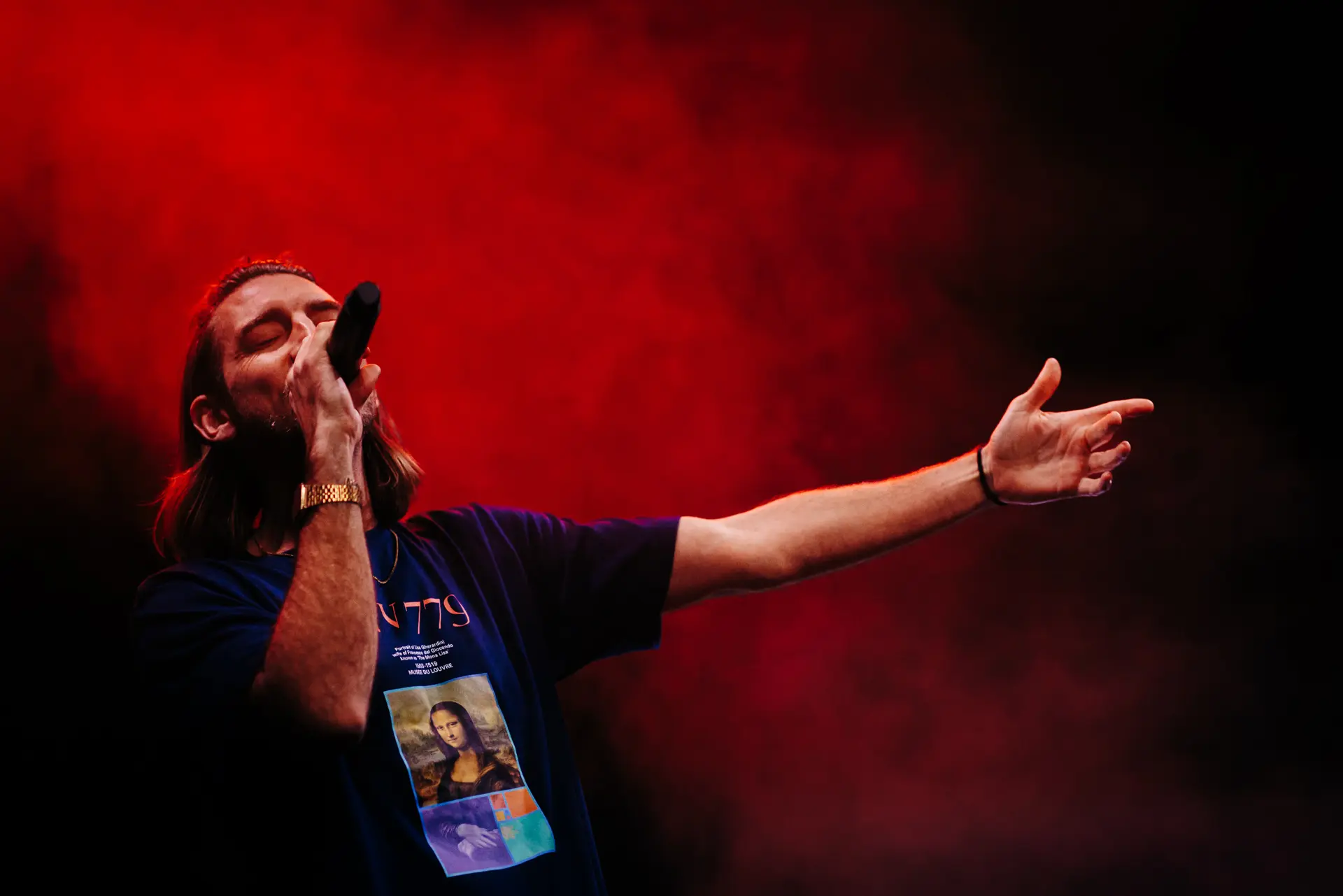 Rap duo Too Many T's performing live on stage at Norwich Arts Centre, rapping into microphones under stage lights and smoke. Captured by Live Music photography specialist, Fourth Wall Photography.