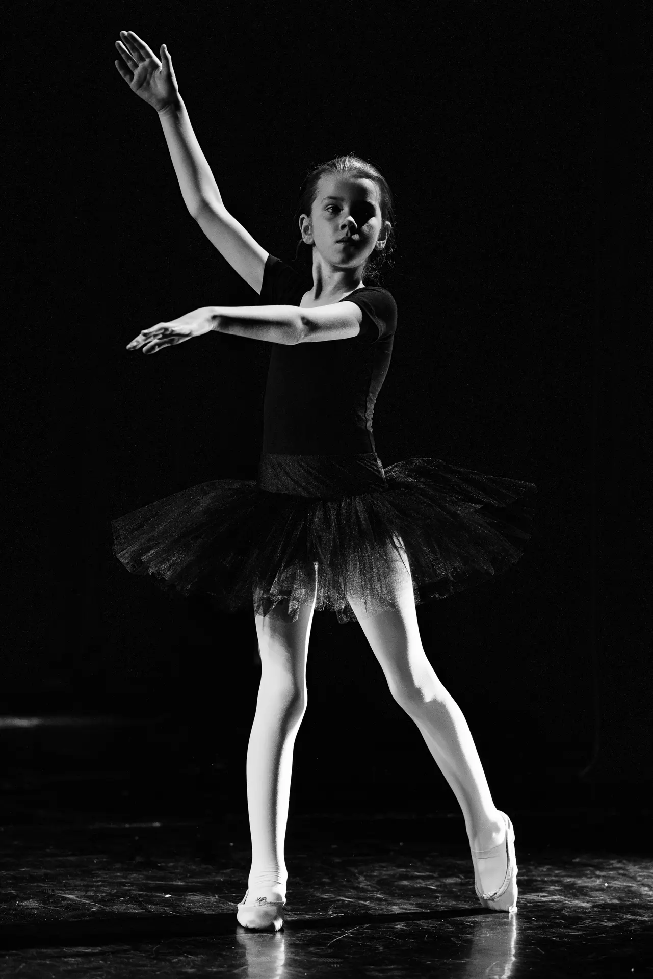 Dancer performing a ballet routine on stage at the True Motion Dance Showcase at the Atrium Theatre in Norfolk, captured mid‑movement with expressive choreography and dynamic lighting. Captured by Dance photography specialist, Fourth Wall Photography.