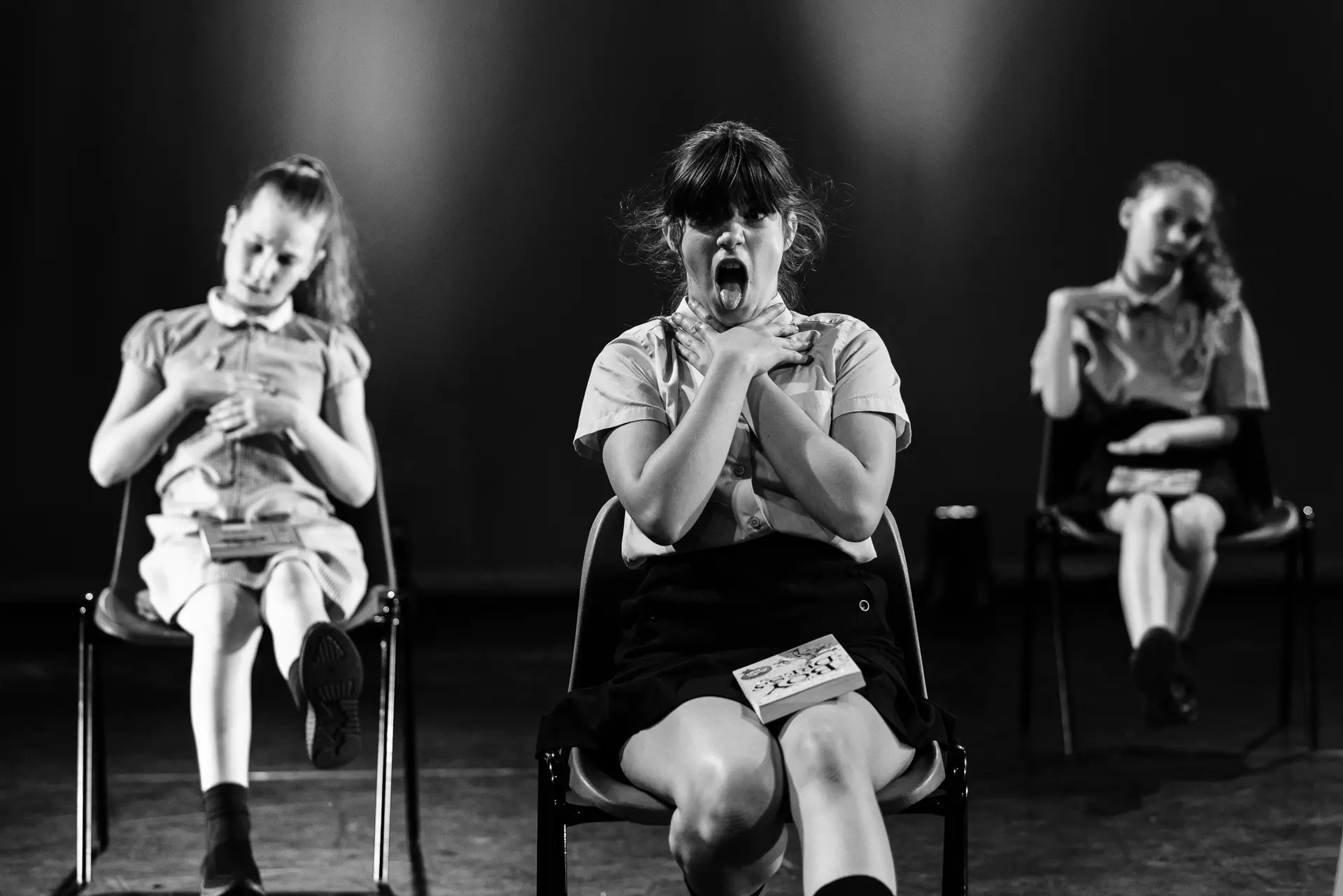 Dancer performing a musical theatre routine on stage at the True Motion Dance Showcase at the Atrium Theatre in Norfolk, captured mid‑movement with expressive choreography and dynamic lighting. Captured by Dance photography specialist, Fourth Wall Photography.