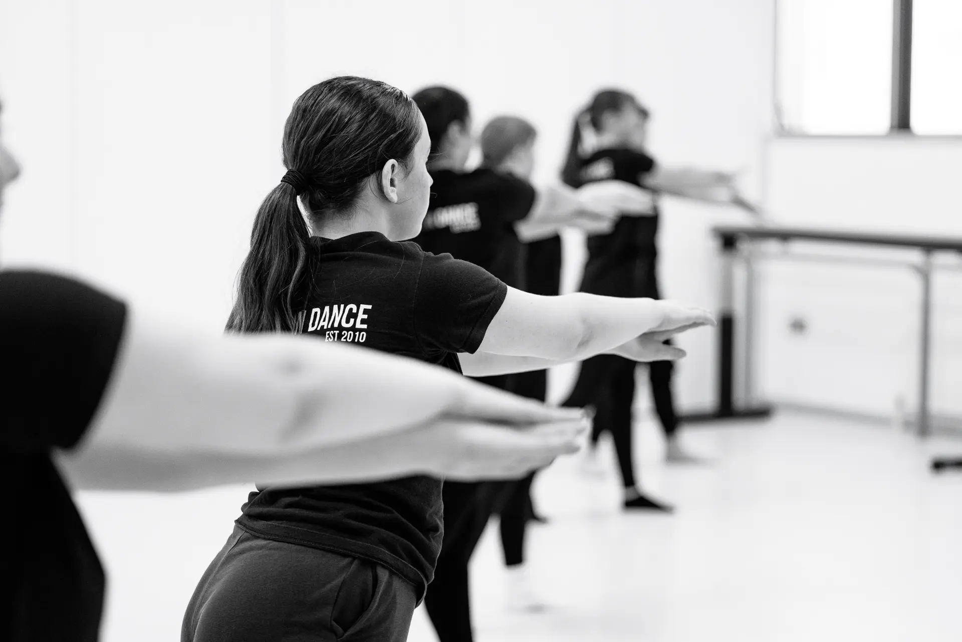 Dancers in a rehearsal for their contemporary dance routine at Dance East in Ipswich. Captured by Dance photography specialist, Fourth Wall Photography.